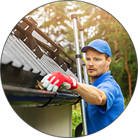 man cleaning gutters