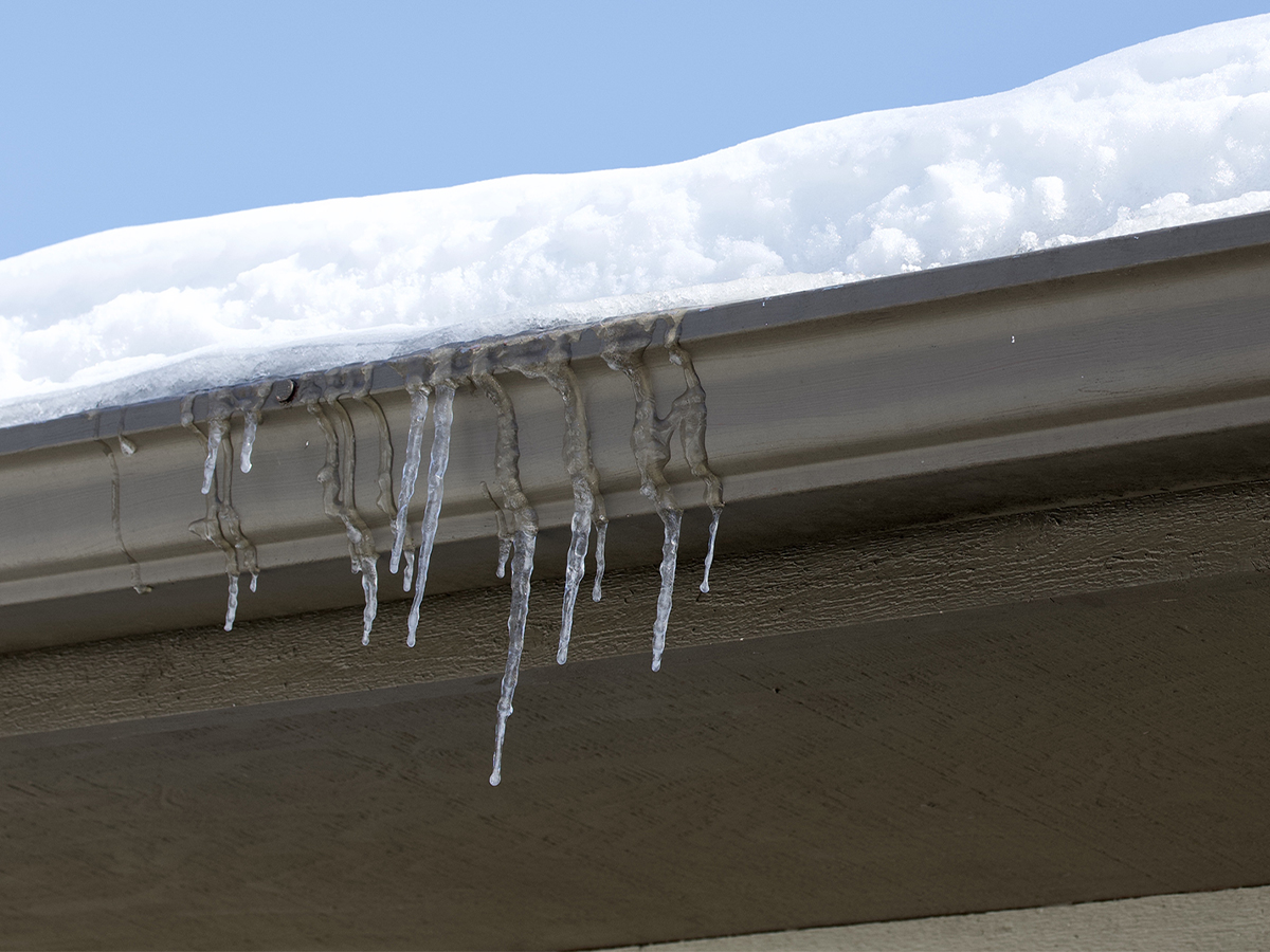 icicles dripping from gutters in winter