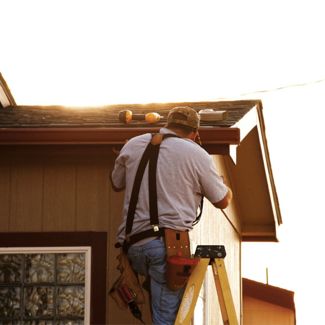 professional installing gutters
