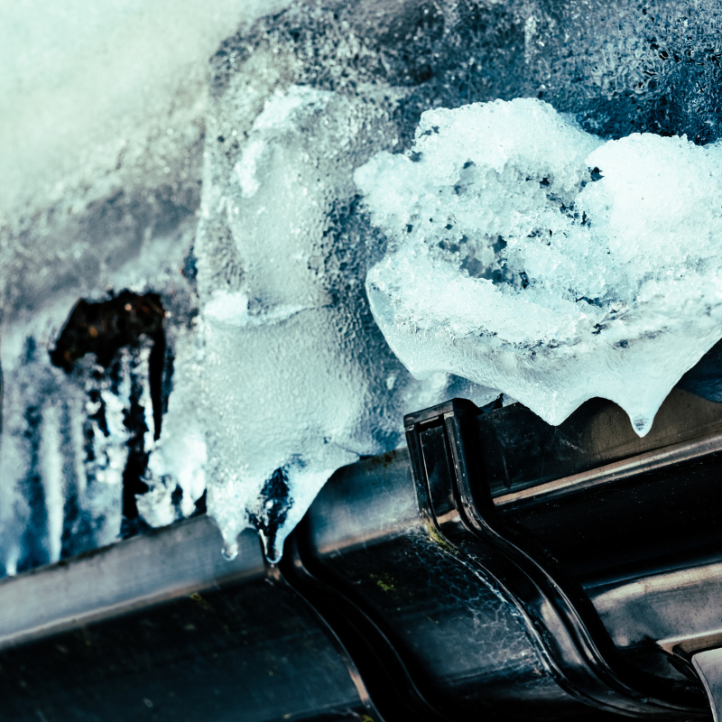 snow and ice on a gutter.